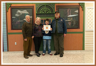 Rooney with proud grandparents (l to r) Dennis & Regina McManus