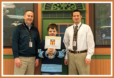 Rooney withPrincipal Mike Rowe and Assistant Principal Aaron Rae