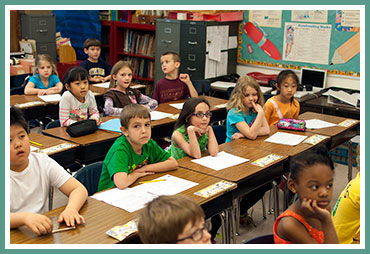 Alyssa with her class, about to hear the news of the pizza party!