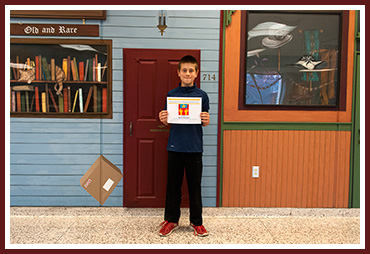 Sam with his award certificate
